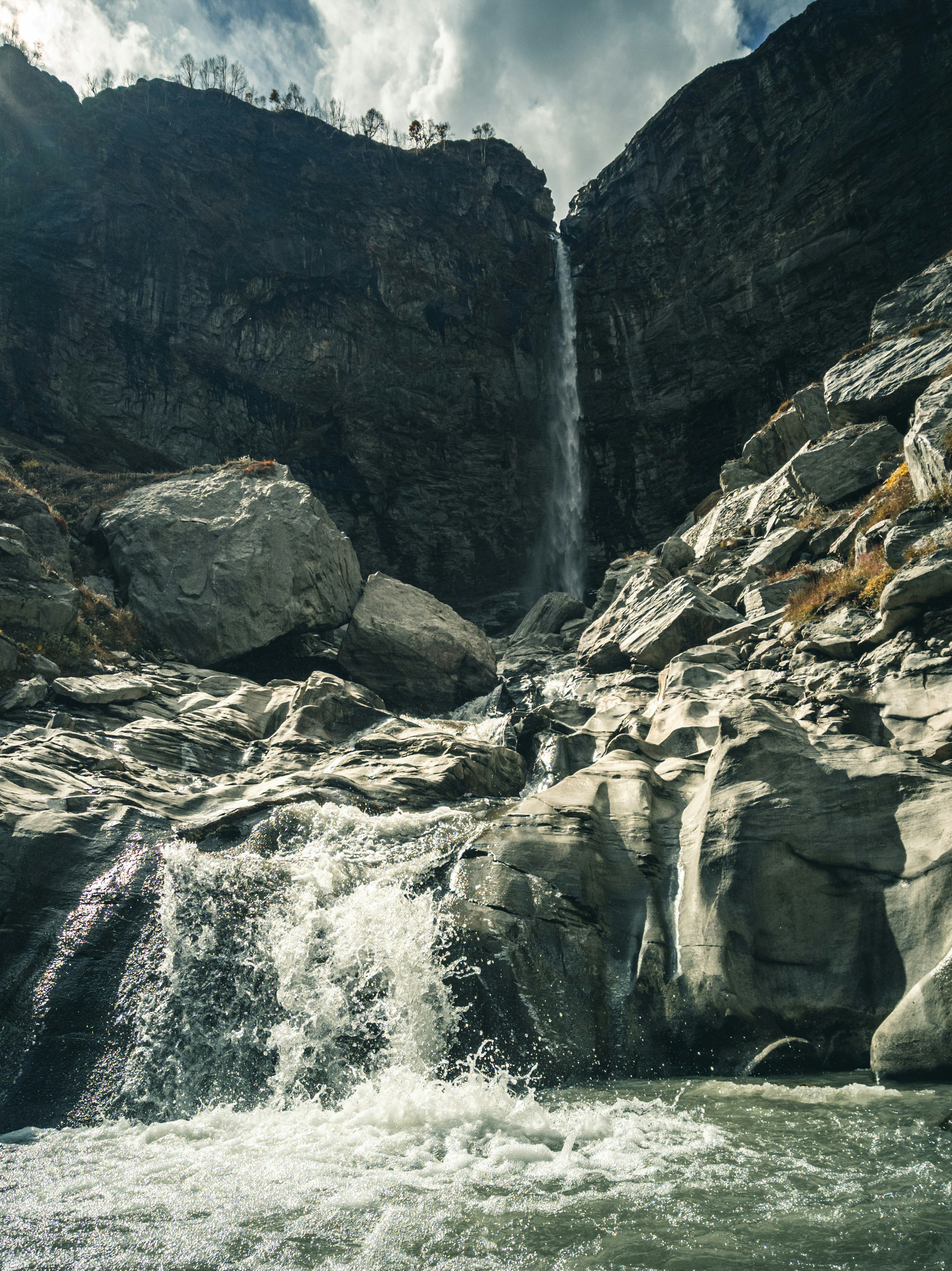 water falls on rocky mountain